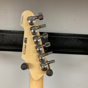 Close-up of the back of a 2019 ESP USA M-II Purple Haze Burst electric guitar headstock, highlighting six tuning pegs, serial number US190503, and ESP manufacturer details engraved on light wood. This American-made instrument exemplifies exceptional craftsmanship and includes a matching case.