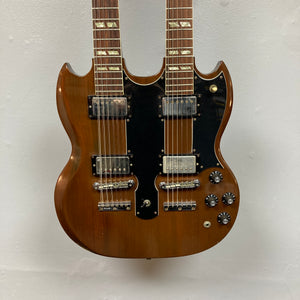 A 1978 Gibson EDS-1275 Double Neck Walnut electric guitar by Gibson, featuring a brown walnut finish, black pickguards, and multiple control knobs, photographed against a plain white background.