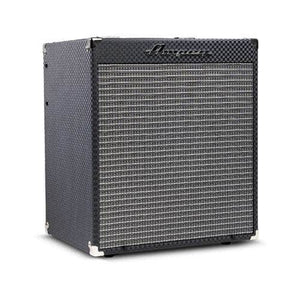 The Ampeg RB110 Rocket Bass Amp features a black textured exterior, silver corner protectors, gray woven grill, Super Grit Technology, and the Ampeg logo on the front panel.