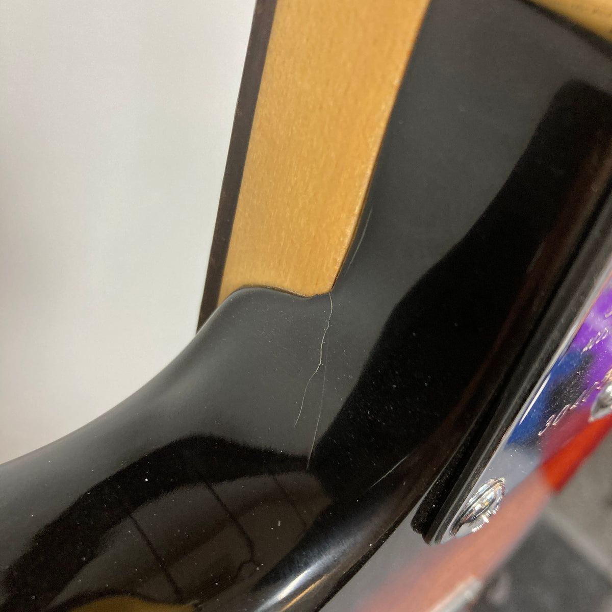 Close-up of the ARIA PRO II STG-02-3C electric guitar, highlighting its sleek design and HSS pickup configuration for versatile sound.