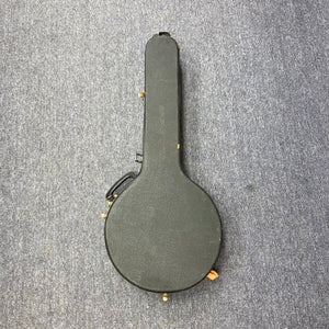 Aria Tenor Banjo 4 String 1970s in black case on carpet, showcasing vintage craftsmanship and quality hardware.