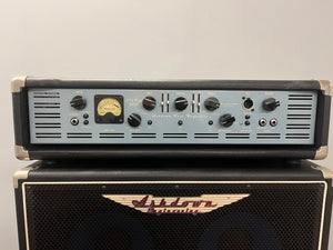 The Ashdown UK Built ABM Bass Rig Full Stack, featuring the EVO II 900 Head, 410T and 115-500 cabinets in flight cases, forms a classic Ashdown setup for powerful bass performance.
