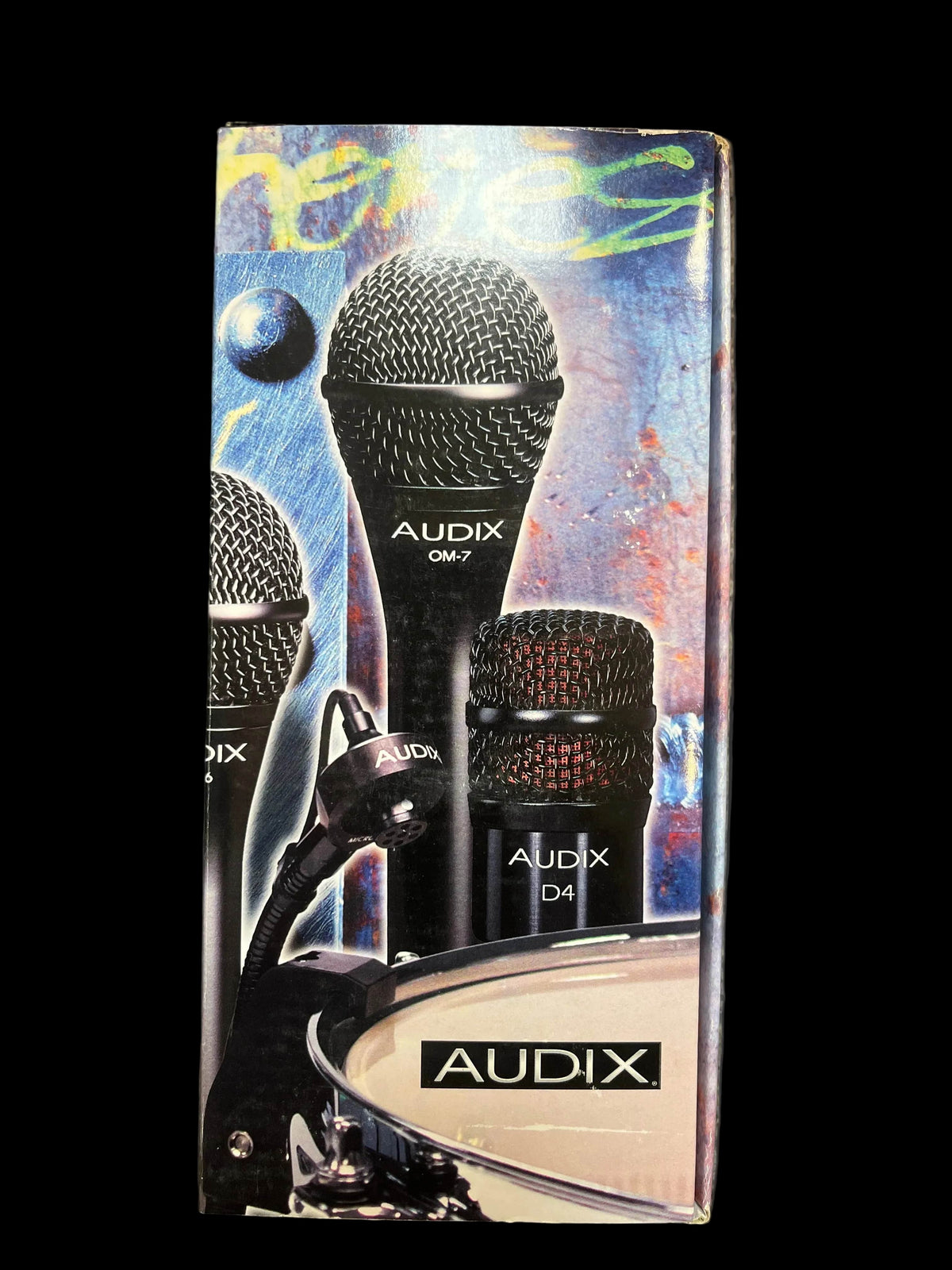 Box displays images of the Audix D4 Hypercardioid Dynamic Instrument Microphone (Preowned), OM7, a drum with the Audix logo, and vibrant abstract art, highlighting the Audix brand and microphone's hypercardioid dynamic design.