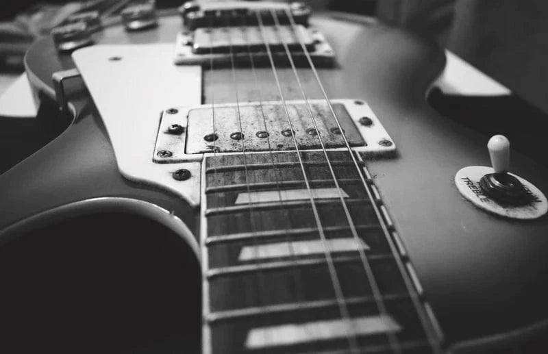 Black and white photo of a Les Paul style guitar Black and white photo of a Les Paul style guitar