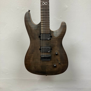 Chapman ML1 Pro Modern Lunar electric guitar by Chapman, featuring a dark wood finish, dual humbucker pickups, 24-fret neck, two control knobs, and a switch, photographed against a plain white wall.