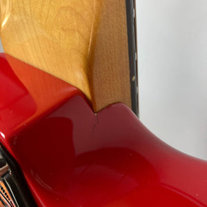 Close-up of a Charvel Model 4 HSS Red w/OHSC Consign by Charvel, highlighting a small crack at the neck-body joint.