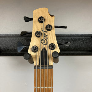 Cort Artisan B5 Element Natural Used bass guitar with visible headstock, neck, and strings, highlighting premium craftsmanship and advanced features for superior performance.