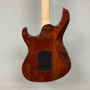 Close-up of the Cort G280 Select Amber guitar, highlighting the Pearloid pickguard, Rosewood fingerboard, and Voiced Tone VTH-77 humbucker.