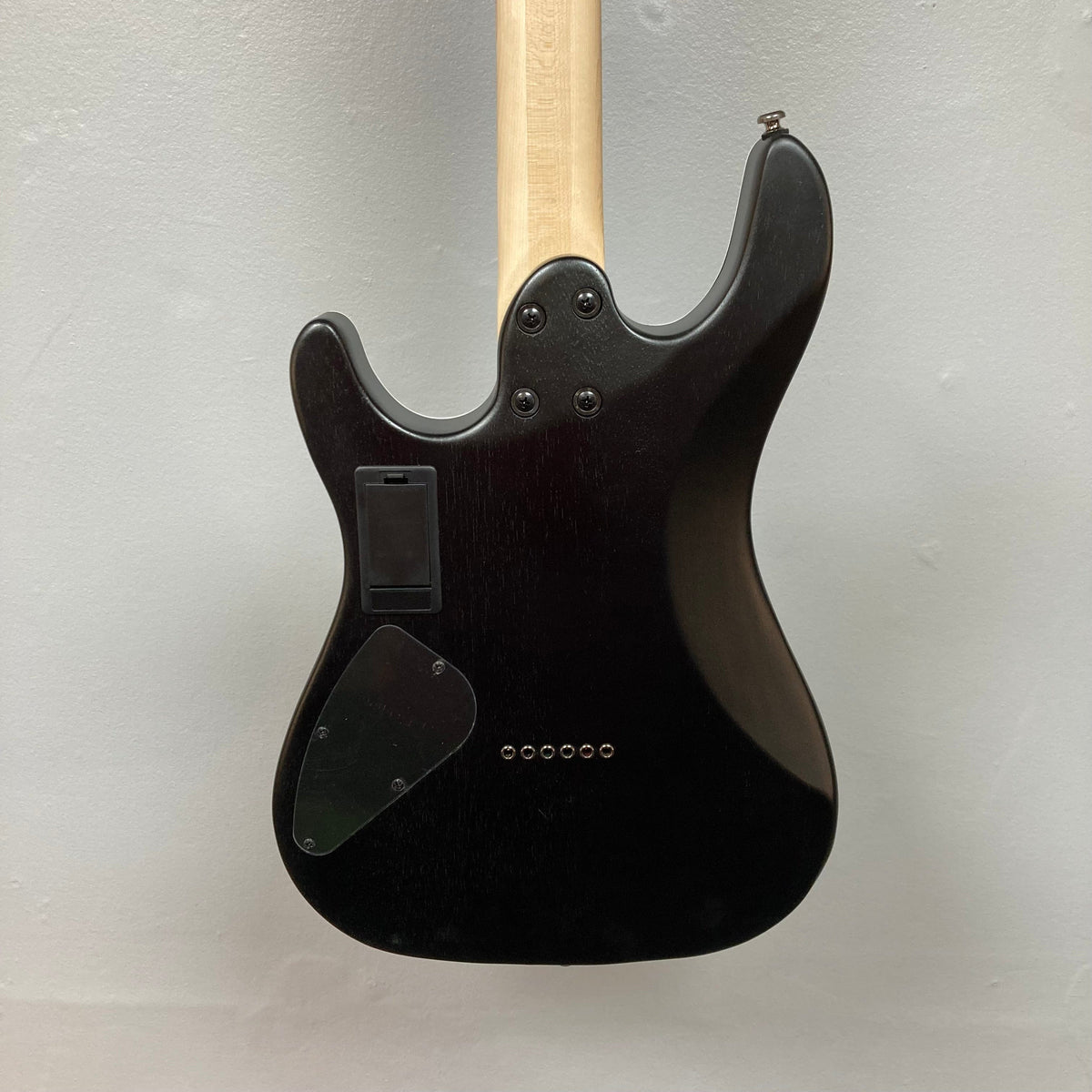 Cort KX300 EBR Etched Black Red electric guitar with a matte black ash top, wooden handle, and EMG® RetroActive Super77 humbuckers.