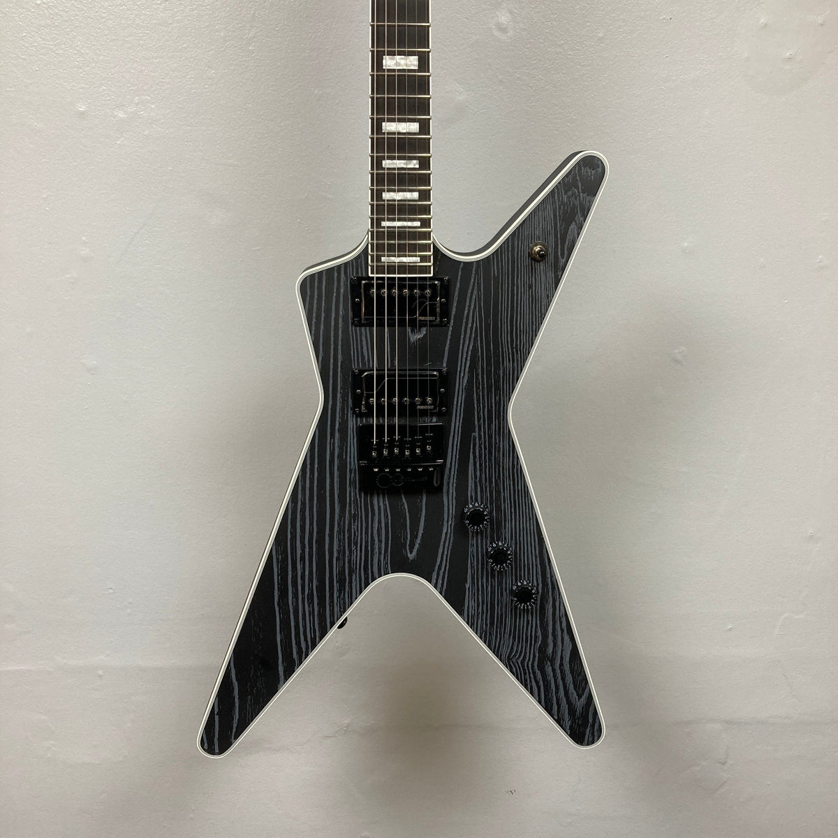 Dean Custom Run #16 ML Sandblasted Grey guitar, showcasing its iconic ML design, Evertune bridge, and Fishman Fluence pickups, limited edition #37 of 100.