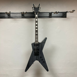 Dean Custom Run #16 ML Sandblasted Grey guitar on a hook, showcasing its distinctive design and craftsmanship, limited to 100 units with premium features.