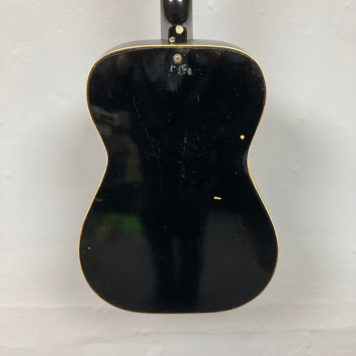 Dobro Model 60 DS Round Neck 1970s Red Burst resonator guitar with noticeable wear, showcasing gold trim and distinct resonator design.