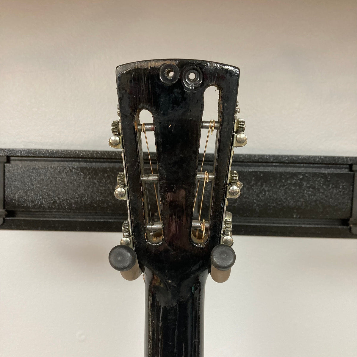 Dobro Model 60 DS Round Neck 1970s Red Burst resonator guitar, showing its back and neck, featuring a distinct resonator and signs of previous use.