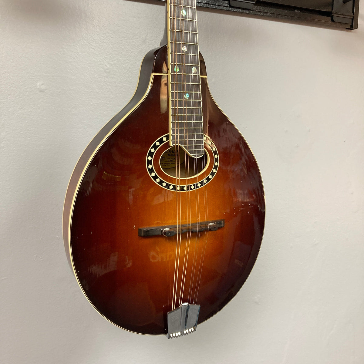 Eastman MD604-GB A-Style Oval-Hole Mandolin displayed, highlighting its expert craftsmanship and unique sound design. Includes a protective case.