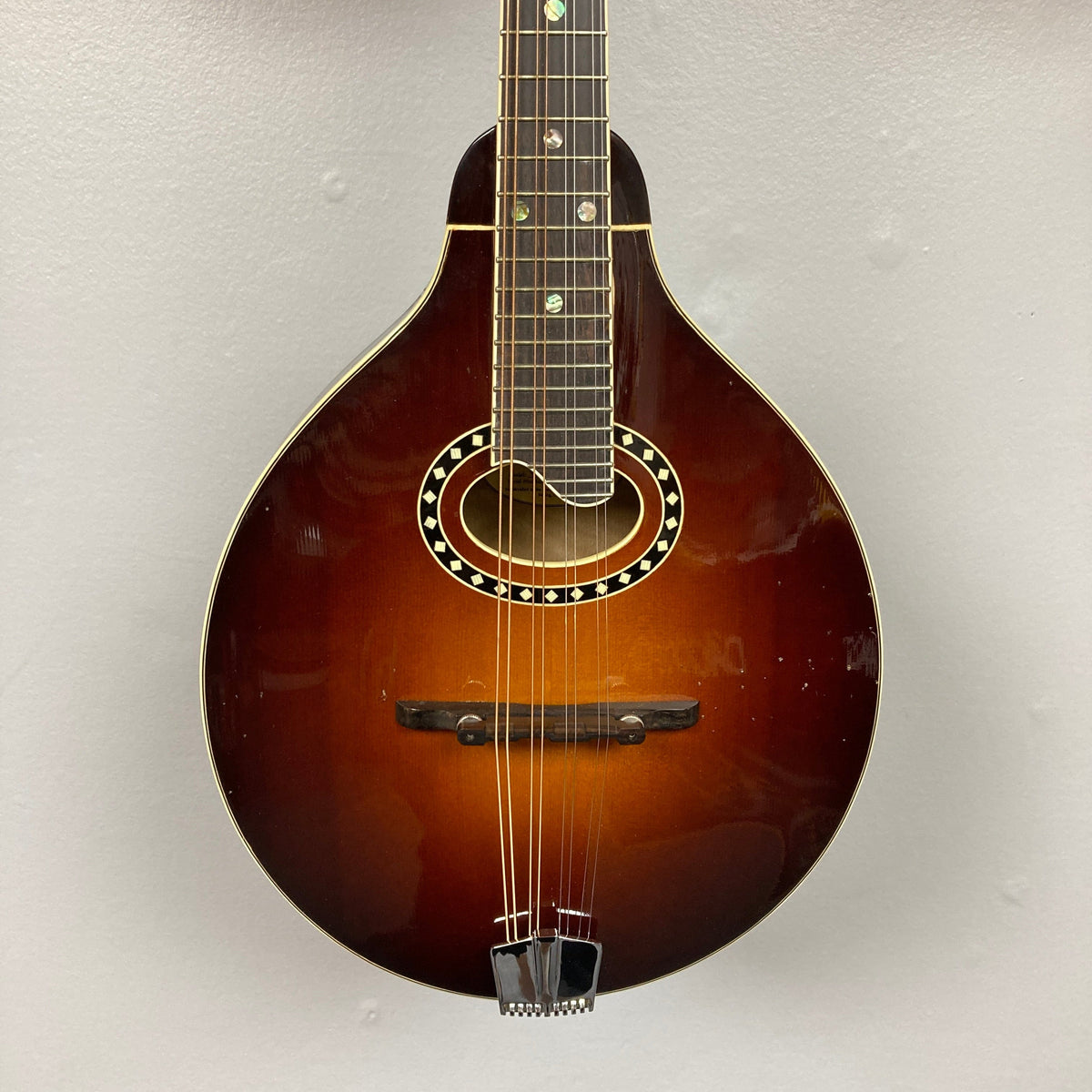 Eastman MD604-GB A-Style Oval-Hole Mandolin with case, showcasing intricate string details and expert craftsmanship, perfect for musicians from Guitars on Main.