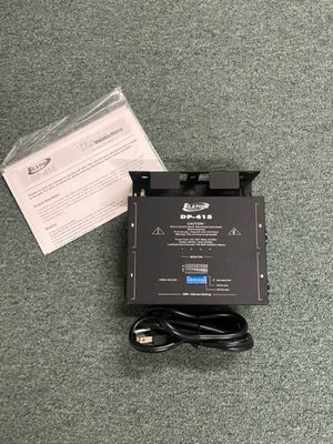 A black Elation Professional DP-415 4-Channel Dimmer/Power Pack is shown on a gray carpet with a power cord and manual, ideal for DMX-compatible stage lighting control.