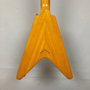 Epiphone 1958 Korina Flying V Left handed guitar, close-up of body and neck details, crafted with vintage accuracy and includes a hardshell case.