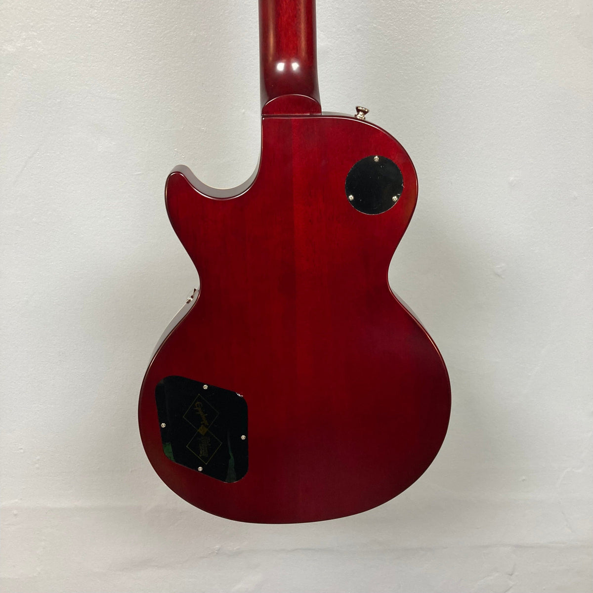 Epiphone 1959 Les Paul Standard Iced Tea Inspired by Gibson, showcasing vintage design with Custombucker pickups and deluxe tuners against a white background.