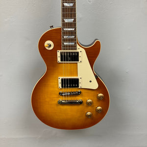 Epiphone 1959 Les Paul Standard Iced Tea Inspired by Gibson, featuring a mahogany body, maple top, Custombucker pickups, and deluxe vintage tuners.