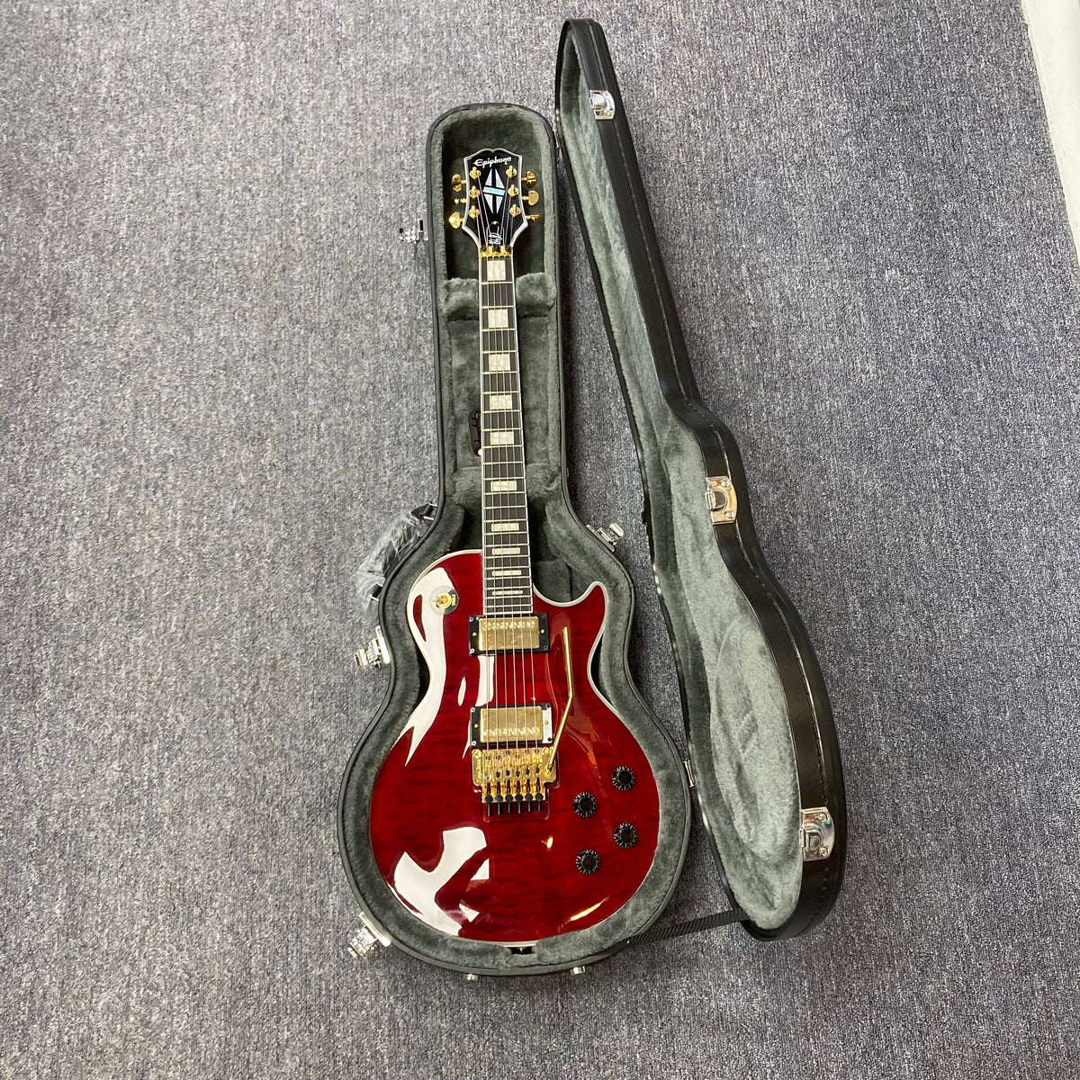 Epiphone Alex Lifeson Les Paul Custom Axcess in a hardshell case, showcasing its meticulous design and powerful Epiphone pickups.