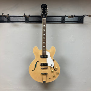Epiphone Casino Natural guitar on a stand, featuring Dogear PRO P-90 pickups and maple body, displayed in Guitars on Main store.