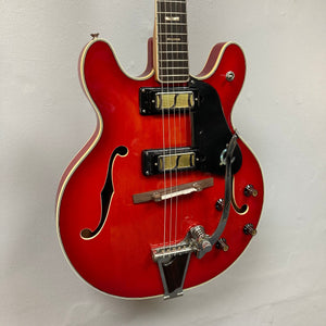 Epiphone EA-250 1972-1974 made in Japan, semi-hollow electric guitar with black strings, double cutaway body, and f-holes.