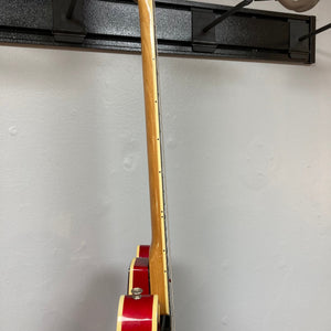 Epiphone EA-250 1972-1974 semi-hollow electric guitar leaning against a wall, showcasing its vintage craftsmanship and double cutaway design.