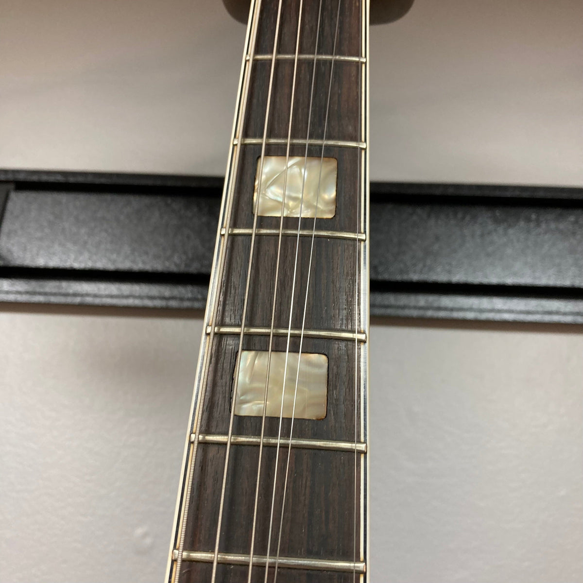 Close-up of Epiphone EA-250 guitar neck and strings, highlighting the craftsmanship of the 1972-1974 Japanese-made semi-hollow electric guitar.