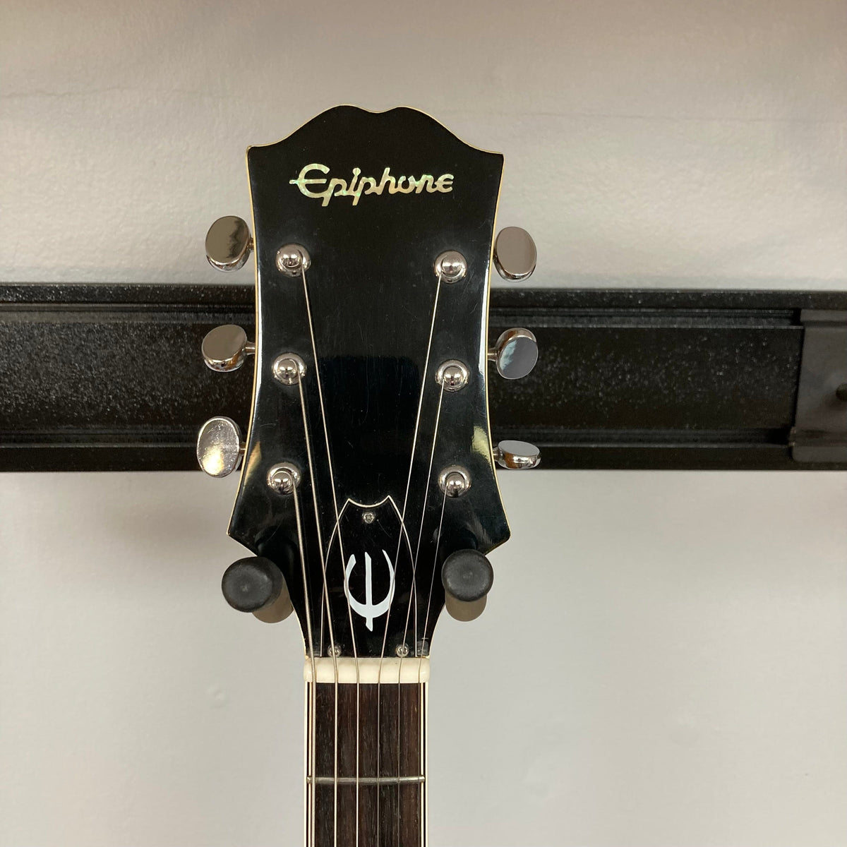 Epiphone EA-250 1972-1974 semi-hollow electric guitar on a stand, featuring a double cutaway body and humbucker pickups. Made in Japan.