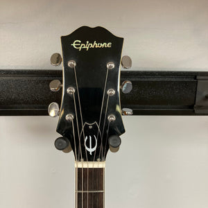 Epiphone EA-250 1972-1974 semi-hollow electric guitar on a stand, featuring a double cutaway body and humbucker pickups. Made in Japan.