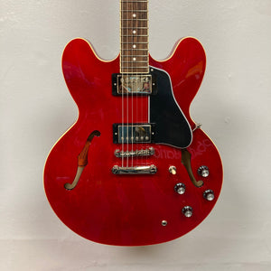 Epiphone ES-335 Semi-hollowbody Electric Guitar - Cherry, featuring silver knobs and strings, known for its classic sound and vintage versatility.