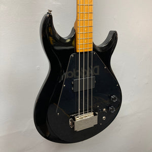 Epiphone Grabber Bass Ebony displayed on wall, showcasing its sleek design and maple neck, ideal for versatile tones and modern playability.