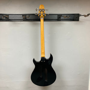 Epiphone Grabber Bass Ebony displayed on wall, showcasing sleek alder body, bolt-on maple neck, and solid hardware, ideal for versatile rock performances.