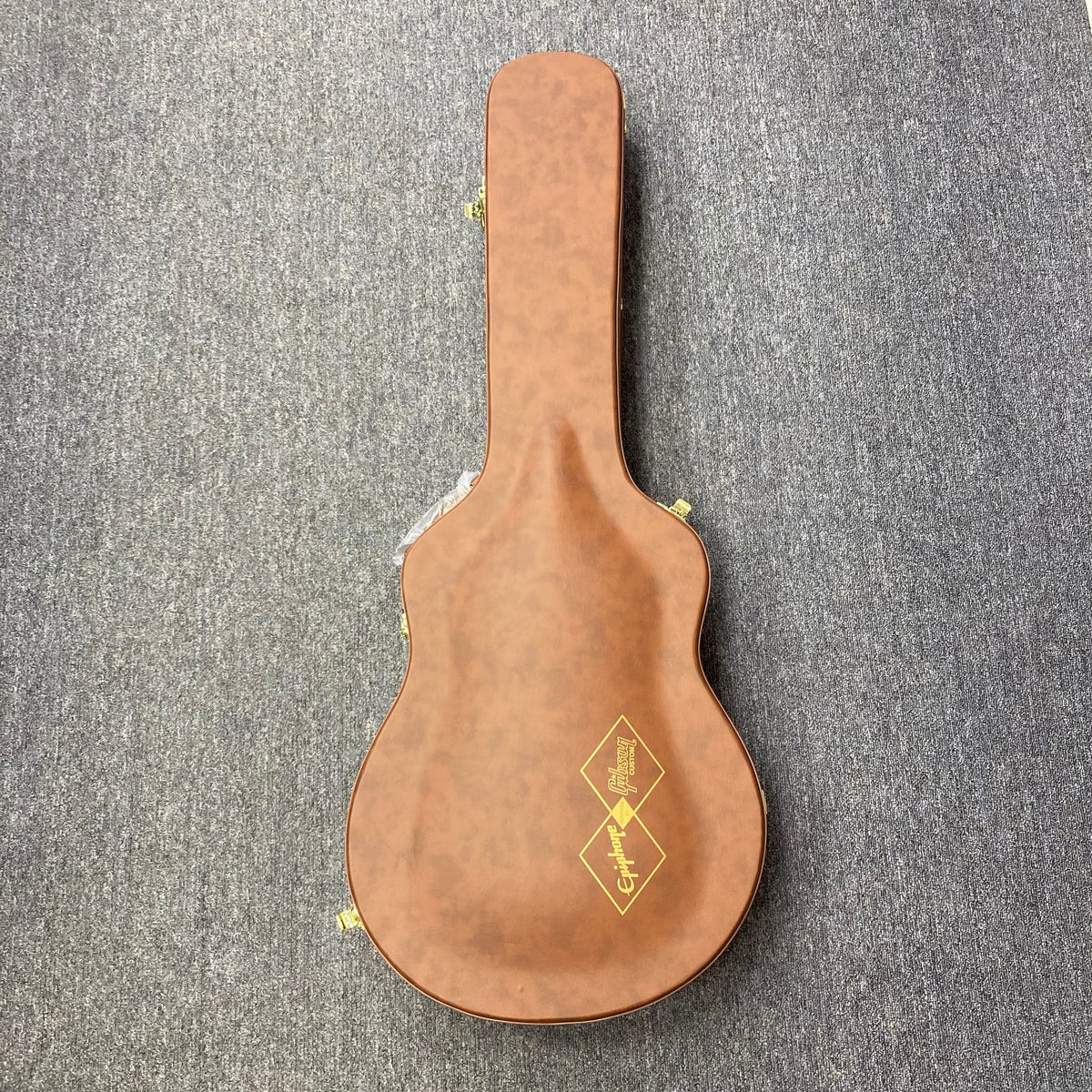 Epiphone IGC 1959 ES-355 Cherry Red Electric Guitar in a brown hardshell case on grey carpet.