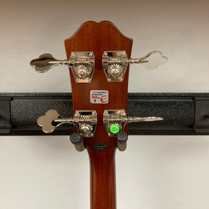 Epiphone Jack Casady Fretless Bass - Aged Royal Tan, showcasing close-up details of its fretless neck and intricate metal components.