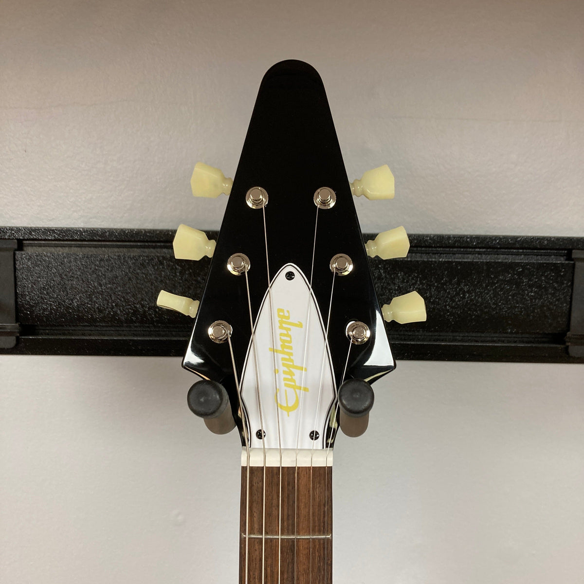 Epiphone Jimi Hendrix Love Drops Flying V guitar with tuning pegs visible, highlighting its iconic Flying V shape and craftsmanship.