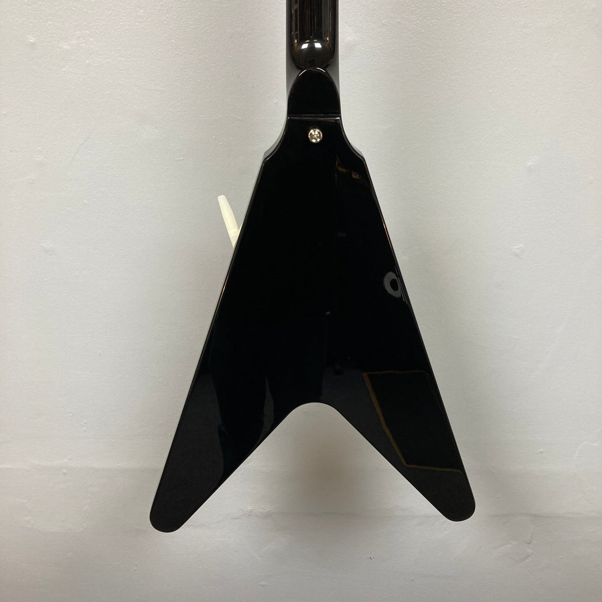 Epiphone Jimi Hendrix Love Drops Flying V guitar with a white handle, showcasing its distinctive Flying V shape and intricate design details.