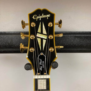 Epiphone Joe Bonamassa 59 Les Paul Custom Bigsby guitar headstock with mother-of-pearl inlay, gold tuners, and Les Paul Custom truss-rod cover.