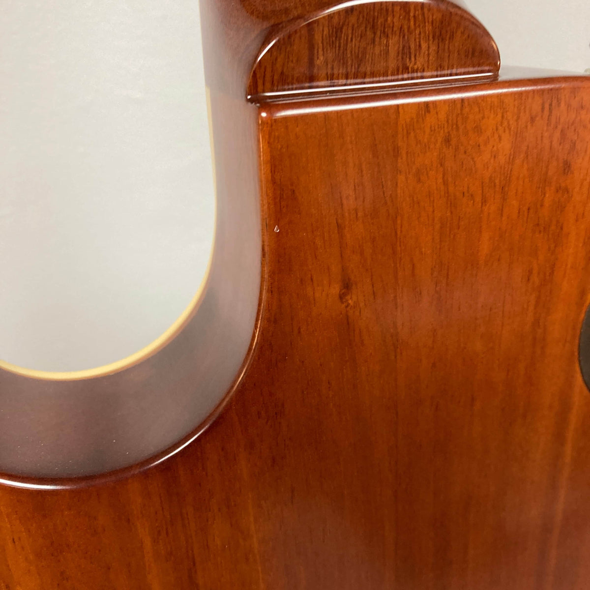 Close-up view of the polished wooden back and neck joint of the Epiphone Les Paul 1957 Goldtop Reissue Blem w/Case, showcasing Epiphone's craftsmanship and iconic design.