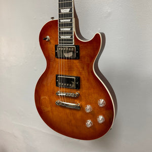 Epiphone Les Paul Modern Figured Mojave Burst electric guitar displayed on a wall, showcasing detailed craftsmanship and premium features, including ProBucker pickups and Grover Locking Rotomatic tuners.