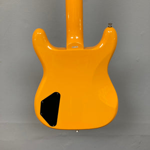 Epiphone Newport Bass California Coral, featuring a unique body shape, mahogany construction, and modern controls, displayed on a wall.
