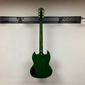 An Epiphone SG Modern Figured Iguana Burst w/GigBag electric guitar is hung backwards on a black wall-mounted rack against a plain white wall.