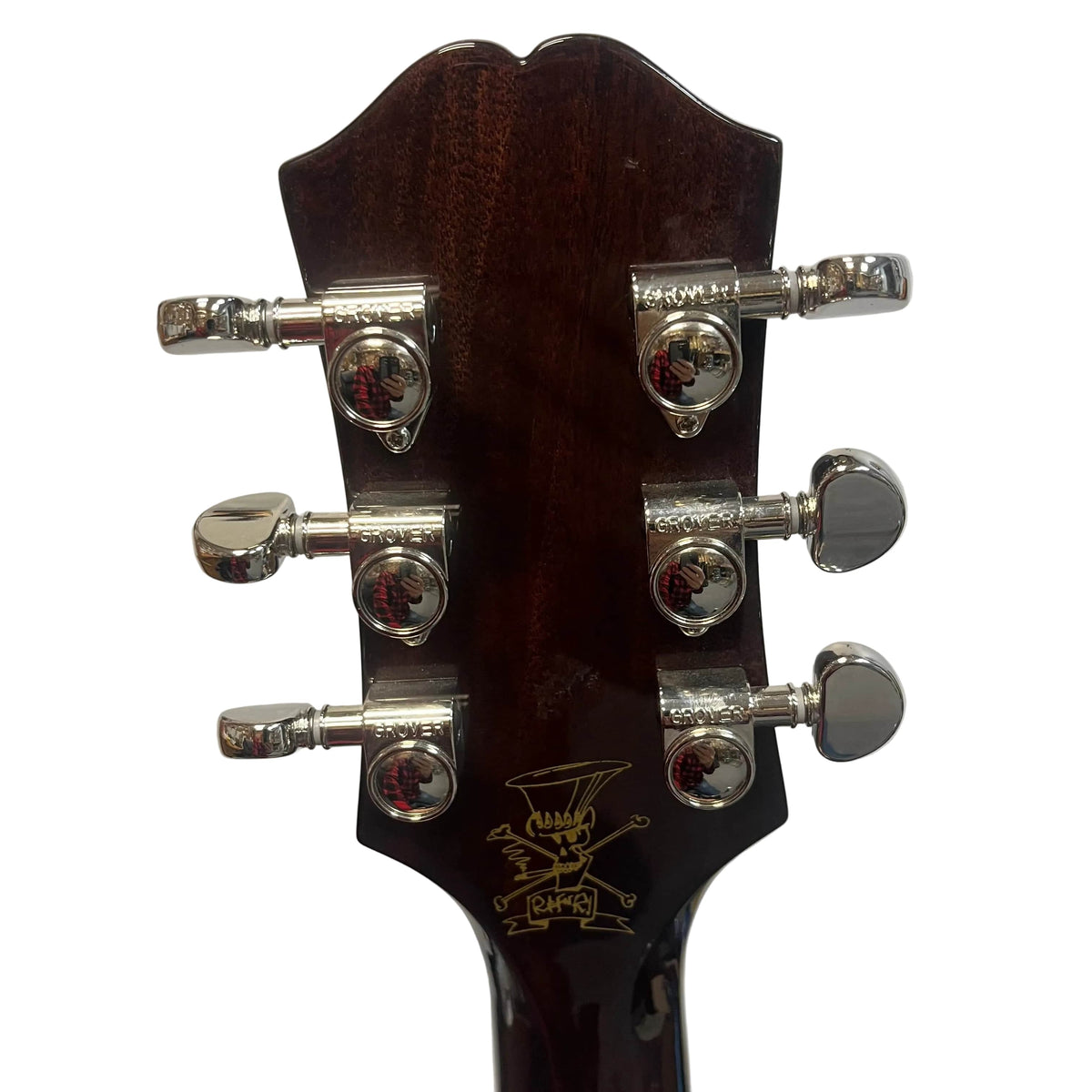 Close-up of the back of the Epiphone Slash J-45 Acoustic Guitar w/Case headstock, highlighting six chrome tuning pegs and a gold logo detail.