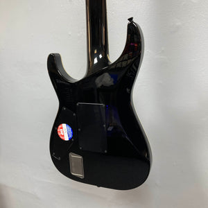 The back of the ESP E-II Horizon FR-7 Black 7-string electric guitar by ESP is shown against a white wall, displaying a sticker and several plastic covers over its electronics.