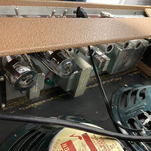 Close-up of Fender '63 Vibroverb Reissue 40-Watt 2x10 Guitar Combo, showcasing vintage-style controls and dual Jensen speakers.