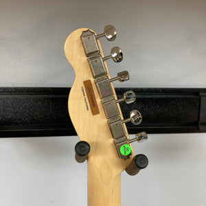 Fender American Performer Telecaster Honeyburst w/GigBag Refurb, featuring a close-up of the guitar neck, tuners, and price tag.
