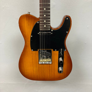 Close-up of Fender American Performer Telecaster Honeyburst, showcasing strings and body details. Features include Yosemite pickups and ClassicGear tuners.