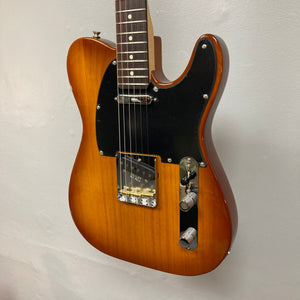 Fender American Performer Telecaster Honeyburst electric guitar on display, showcasing its maple neck and rosewood fingerboard, part of the refurbished collection at Guitars on Main.