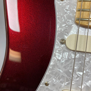 Close-up of a Fender American Standard Strat upgraded Gilmour EMG DC-20 in Bordeaux Metallic, featuring a white pearloid pickguard and gold pickup, highlighting string and screw details. Outfitted with EMG DG-20 David Gilmour pickups for iconic tone.