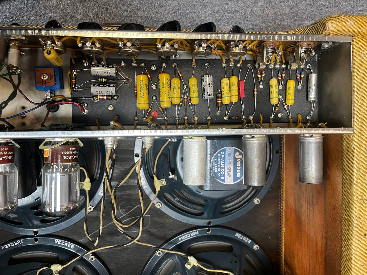 Interior view of a 1957 Fender Bassman 5F6 Narrow Panel 40-Watt 4x10" Guitar Combo shows its electronic components, wiring, and four speakers—highlighting the iconic vintage design by Fender.